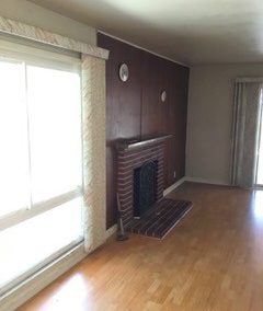 Before - Outdated Fireplace and Living Room